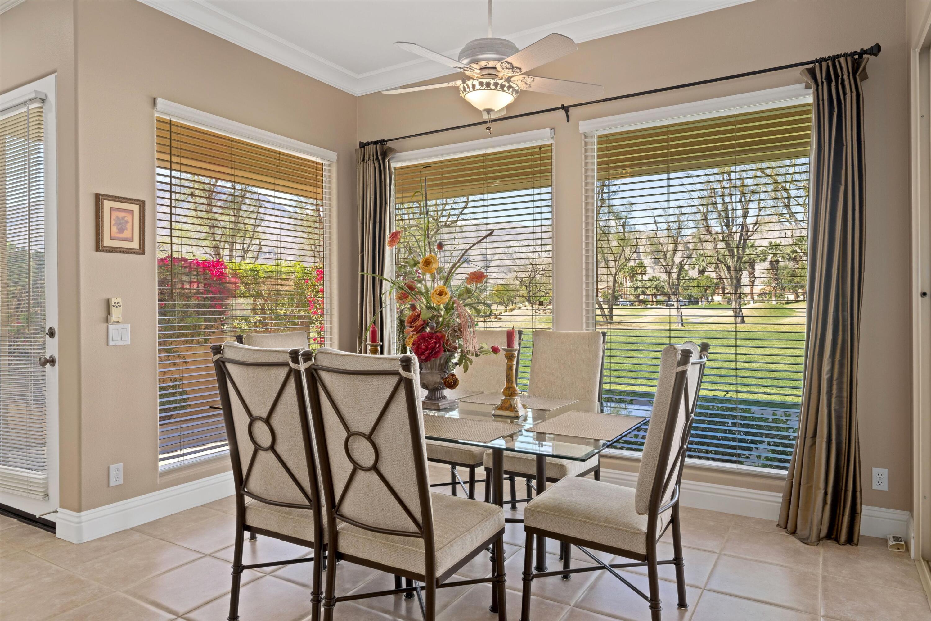 57255 Interlachen La Quinta, CA 92253 - Photo 24 of 34 a view of a dining room with furniture and windows