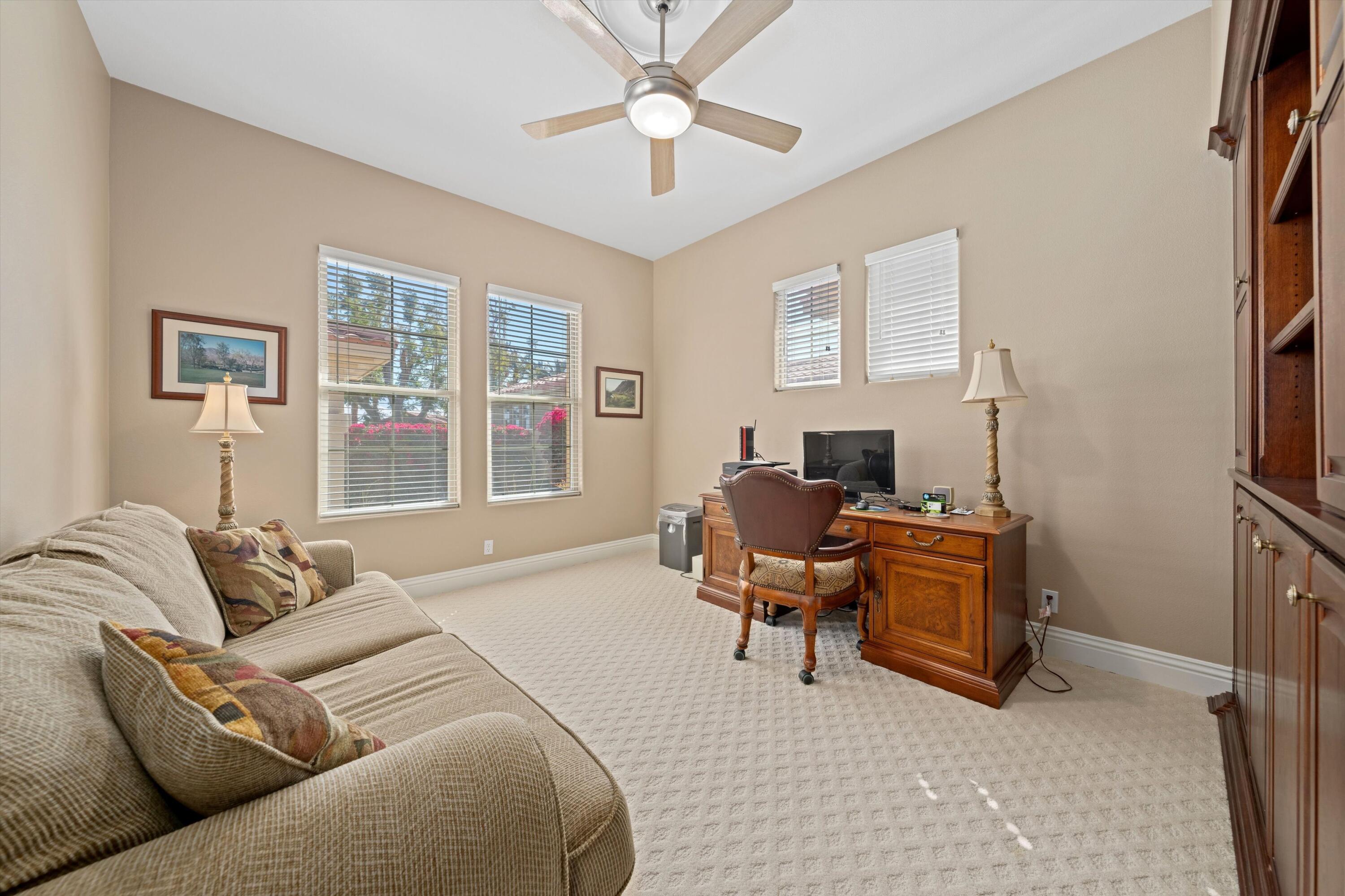 57255 Interlachen La Quinta, CA 92253 - Photo 26 of 34 a livingroom with workspace and a couch