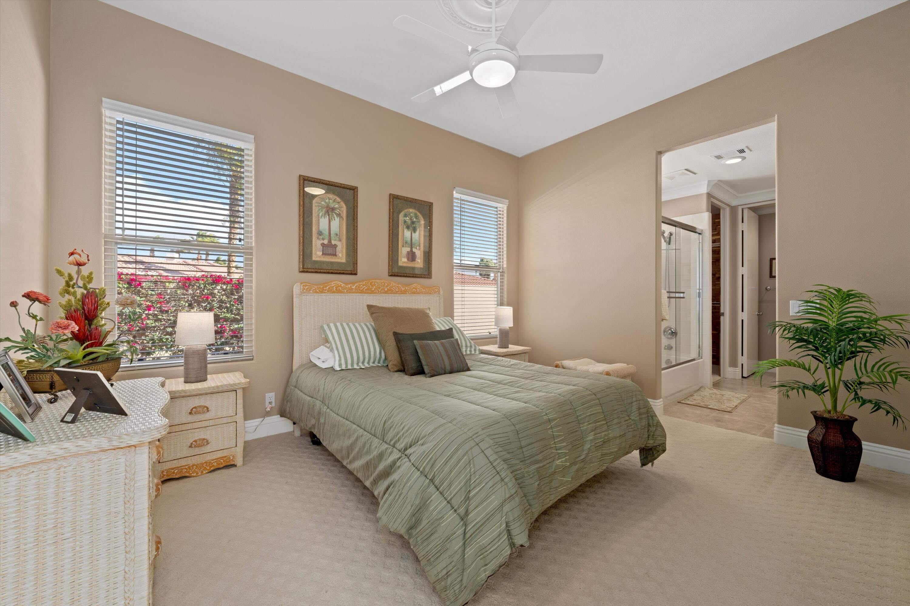 57255 Interlachen La Quinta, CA 92253 - Photo 31 of 34 a bedroom with a bed and a potted plant