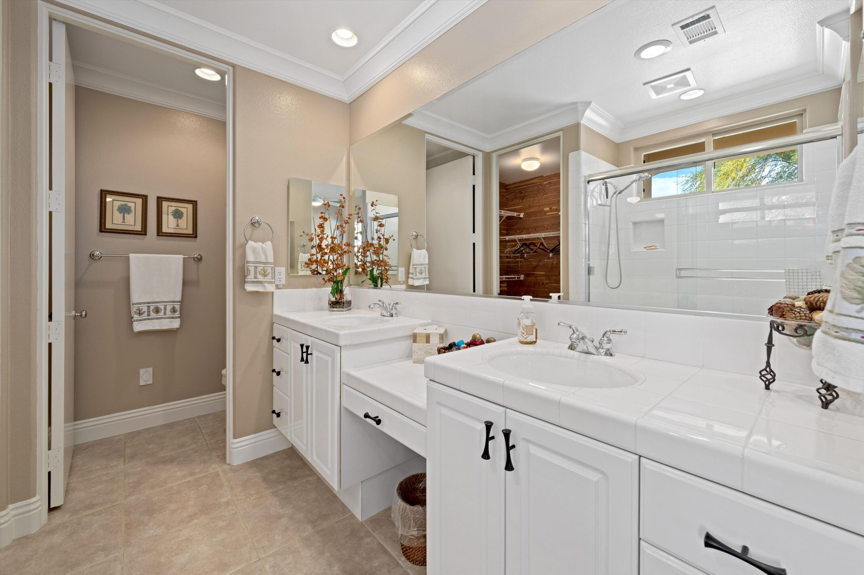 57255 Interlachen La Quinta, CA 92253 - Photo 32 of 34 a bathroom with a double vanity sink mirror and double