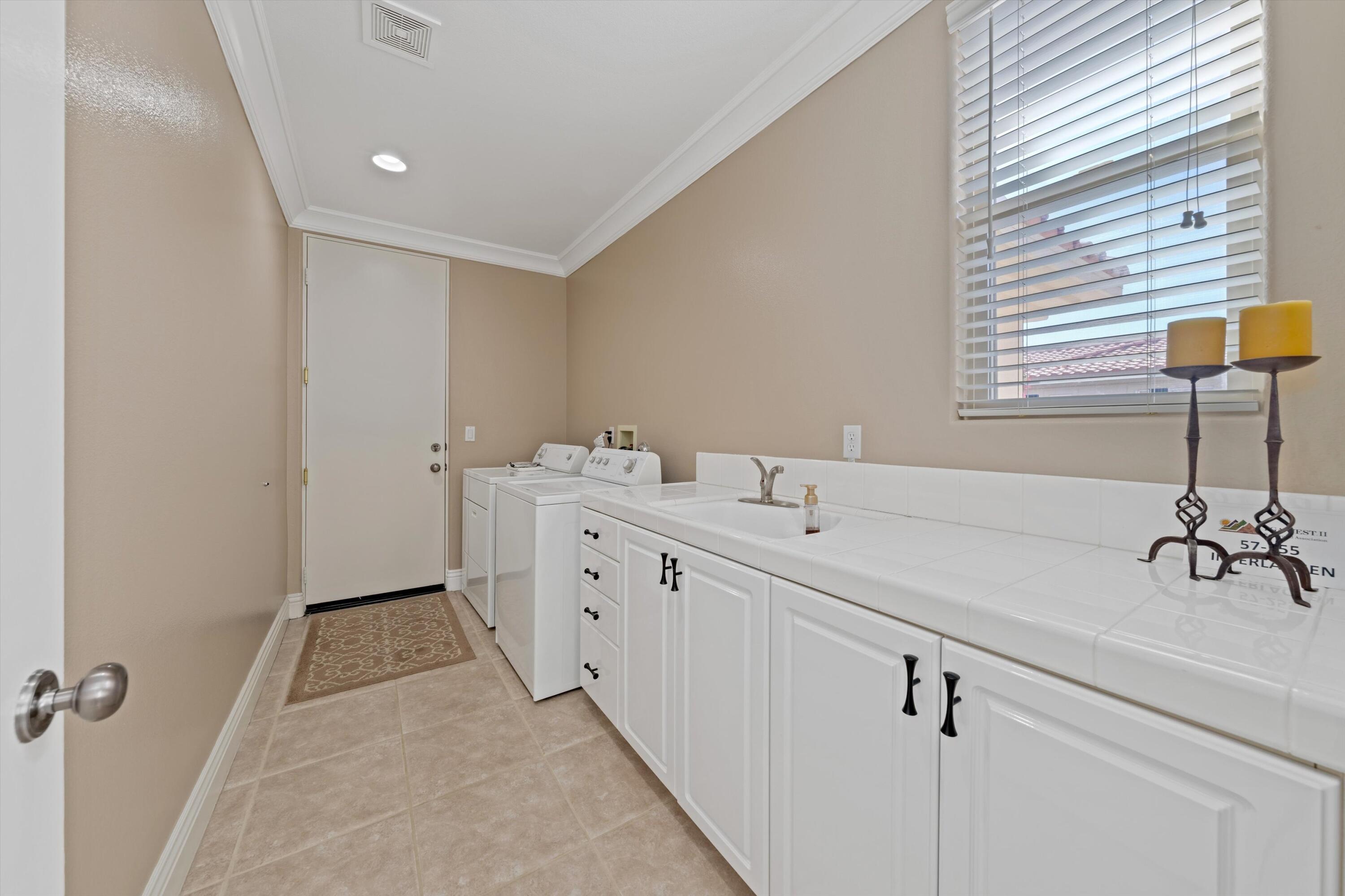 57255 Interlachen La Quinta, CA 92253 - Photo 33 of 34 a bathroom with a sink and a mirror