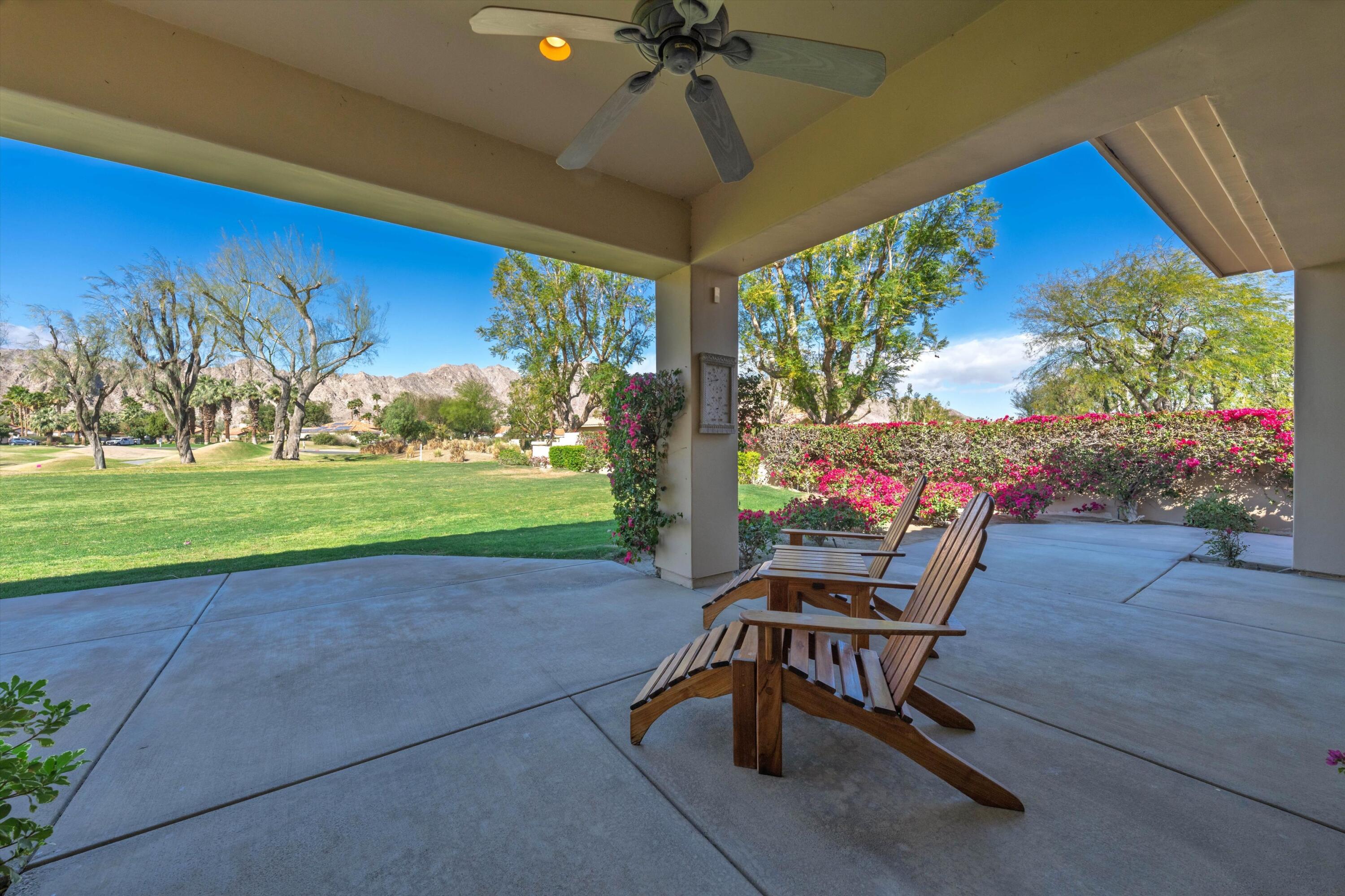 57255 Interlachen La Quinta, CA 92253 - Photo 6 of 34 a view of a porch with furniture and a yard