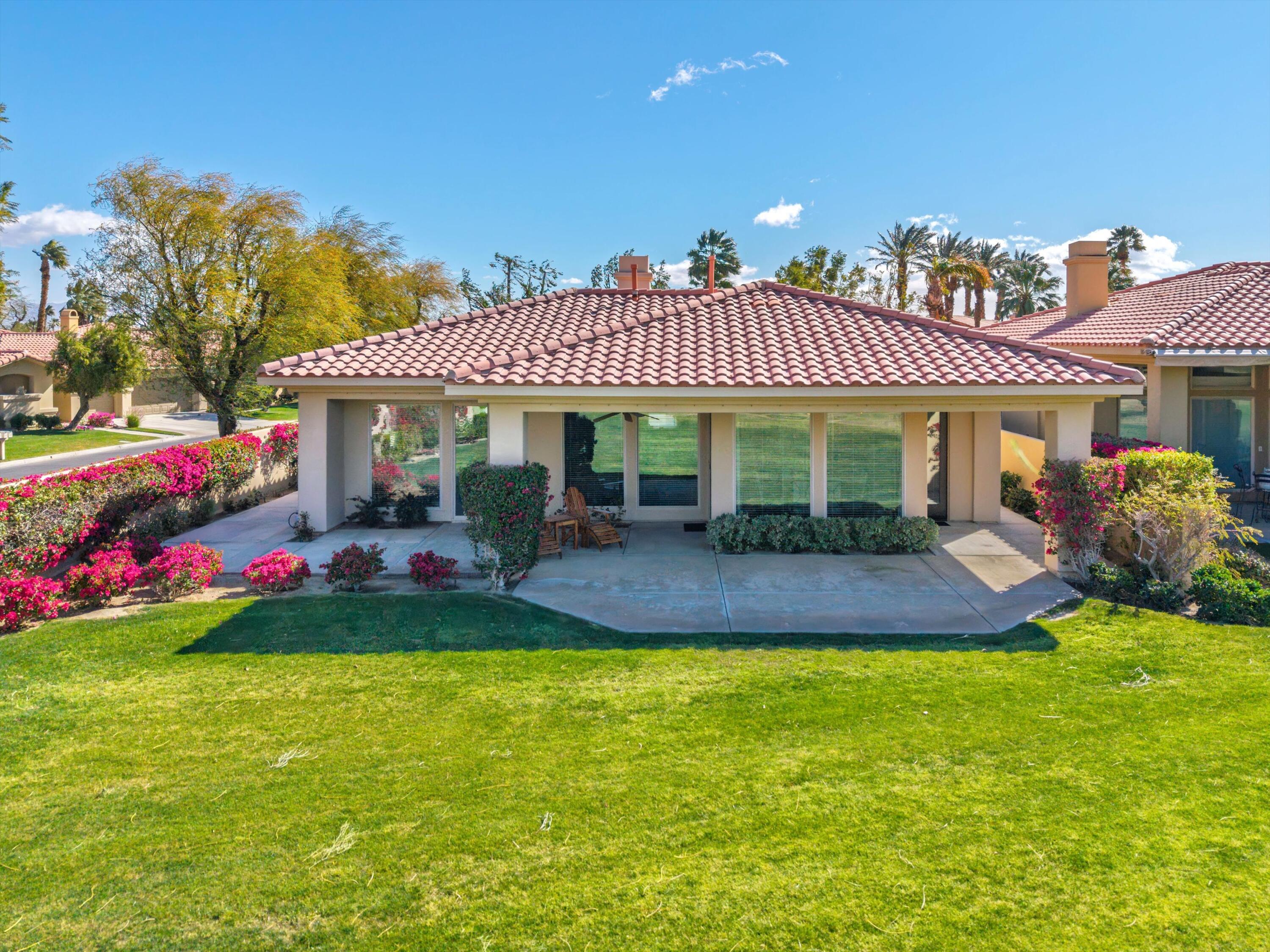 57255 Interlachen La Quinta, CA 92253 - Photo 8 of 34 a view of a house with swimming pool and porch