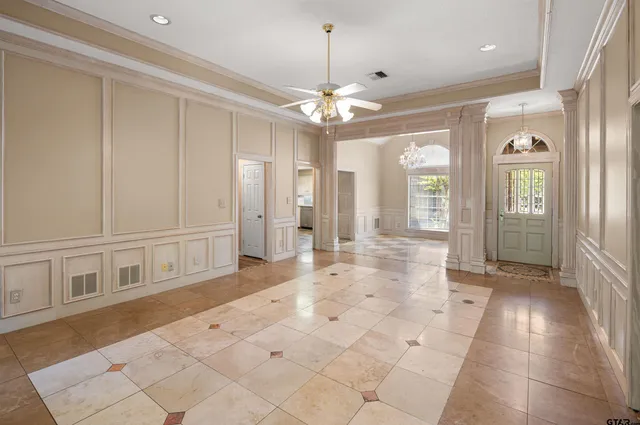 a view of a hallway with granite floor