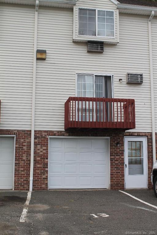 66 Wakelee Road, Unit 13 Waterbury, CT 06705 - Photo 1 of 1 a view of a house with a garage