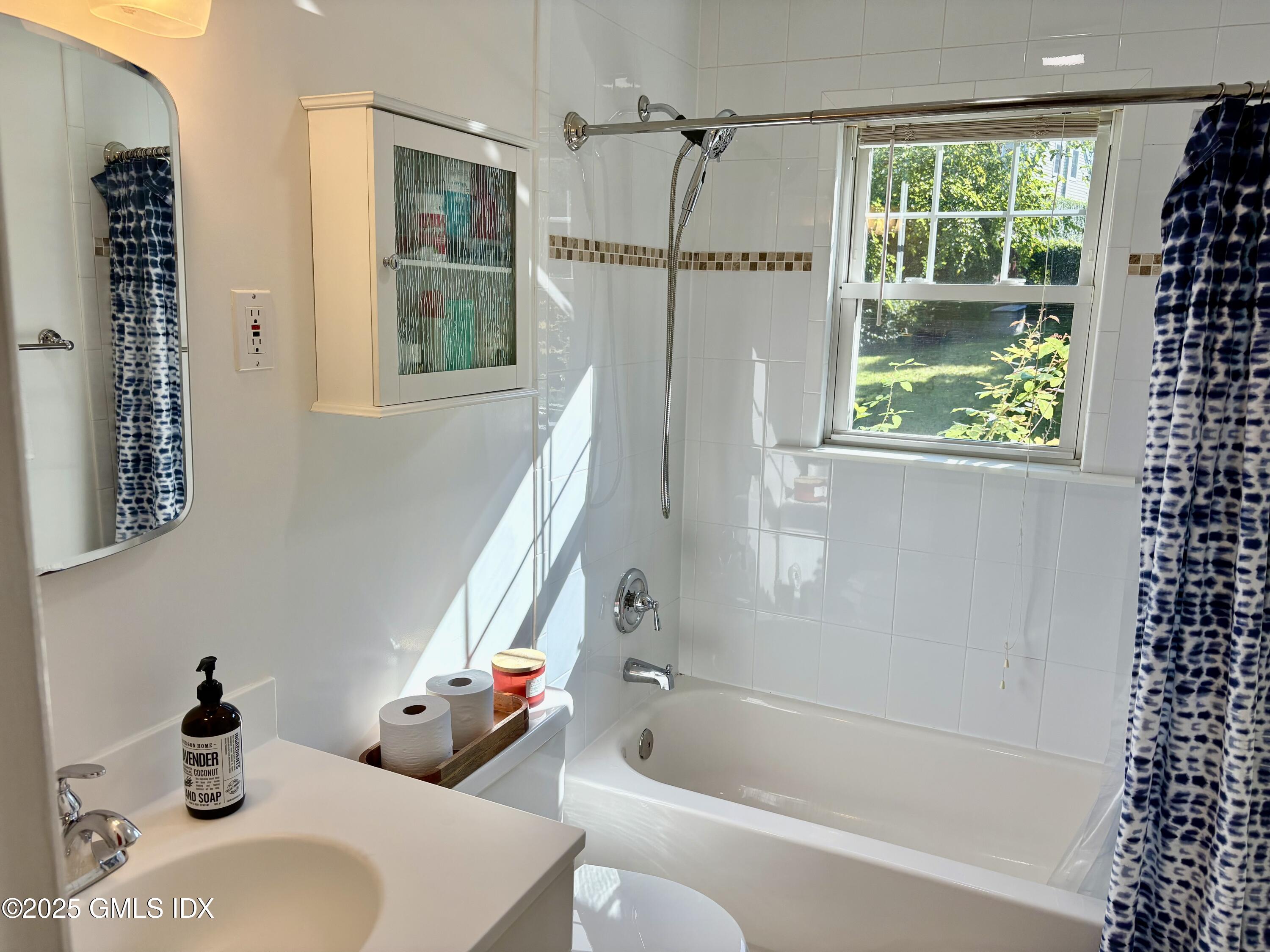 19 Wescott Street Riverside, CT 06878 - Photo 11 of 21 a bathroom with a tub and a shower