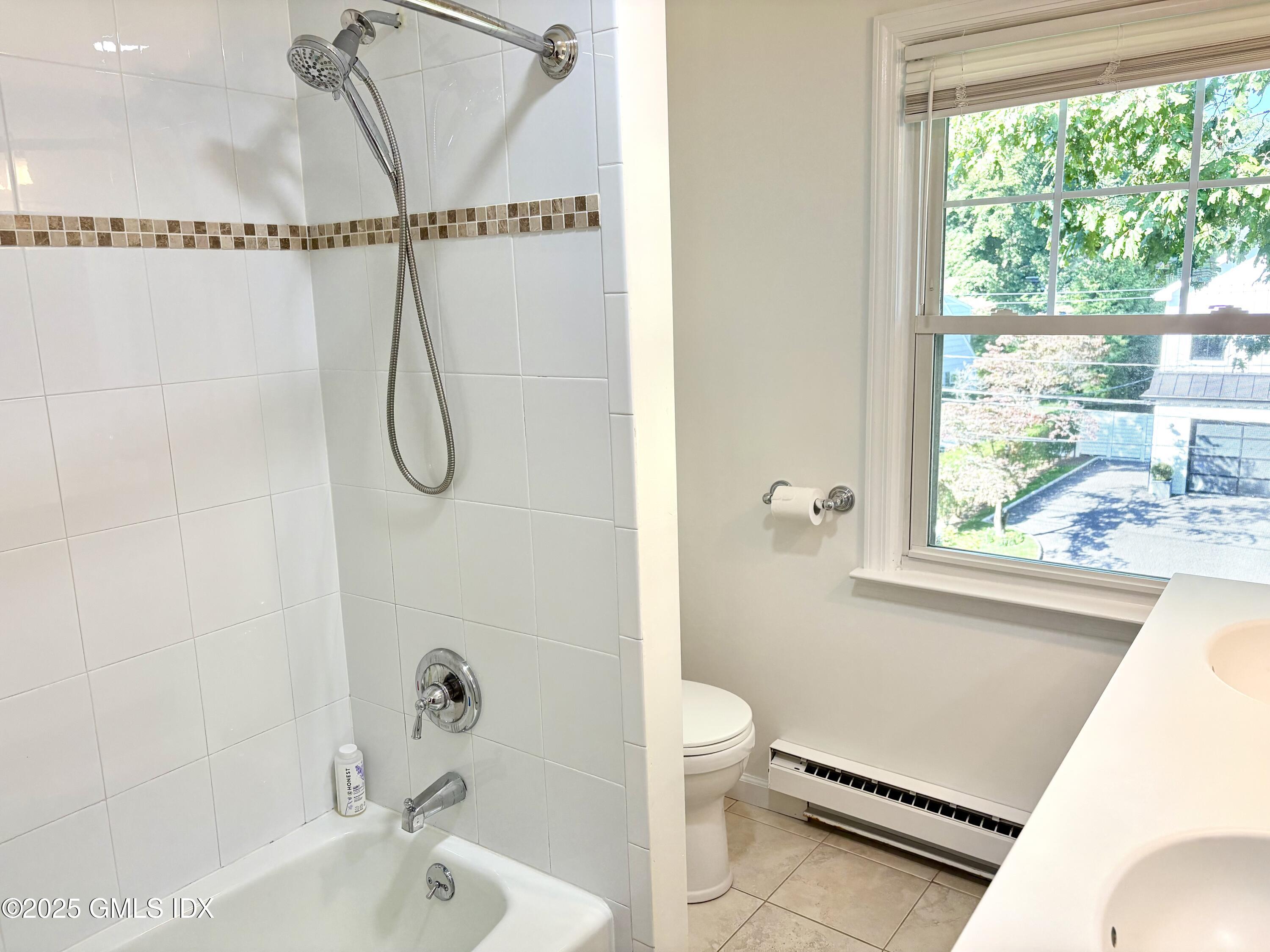 19 Wescott Street Riverside, CT 06878 - Photo 13 of 21 a bathroom with a granite countertop sink a toilet and a bathtub