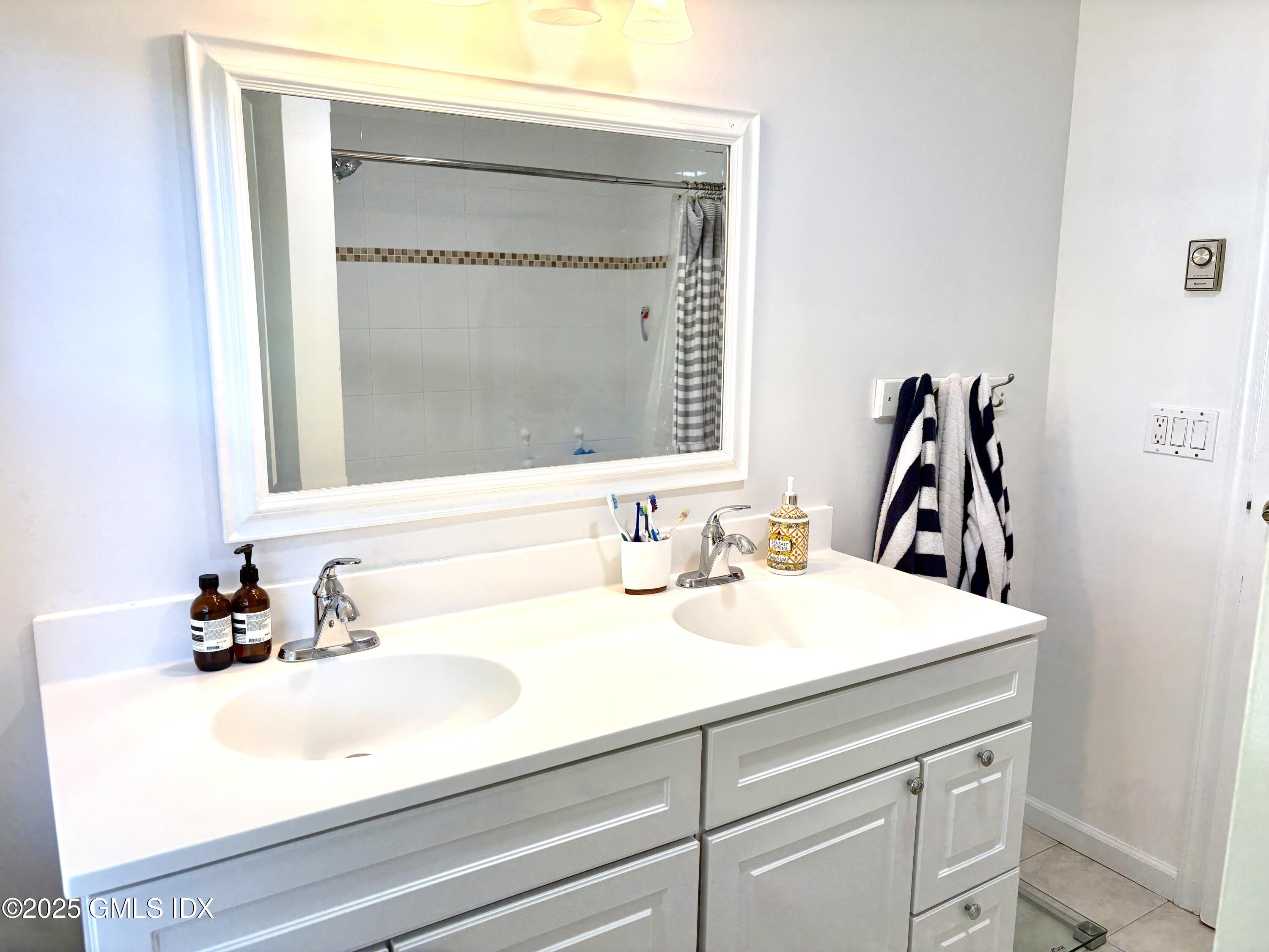 19 Wescott Street Riverside, CT 06878 - Photo 14 of 21 a bathroom with a sink and a mirror