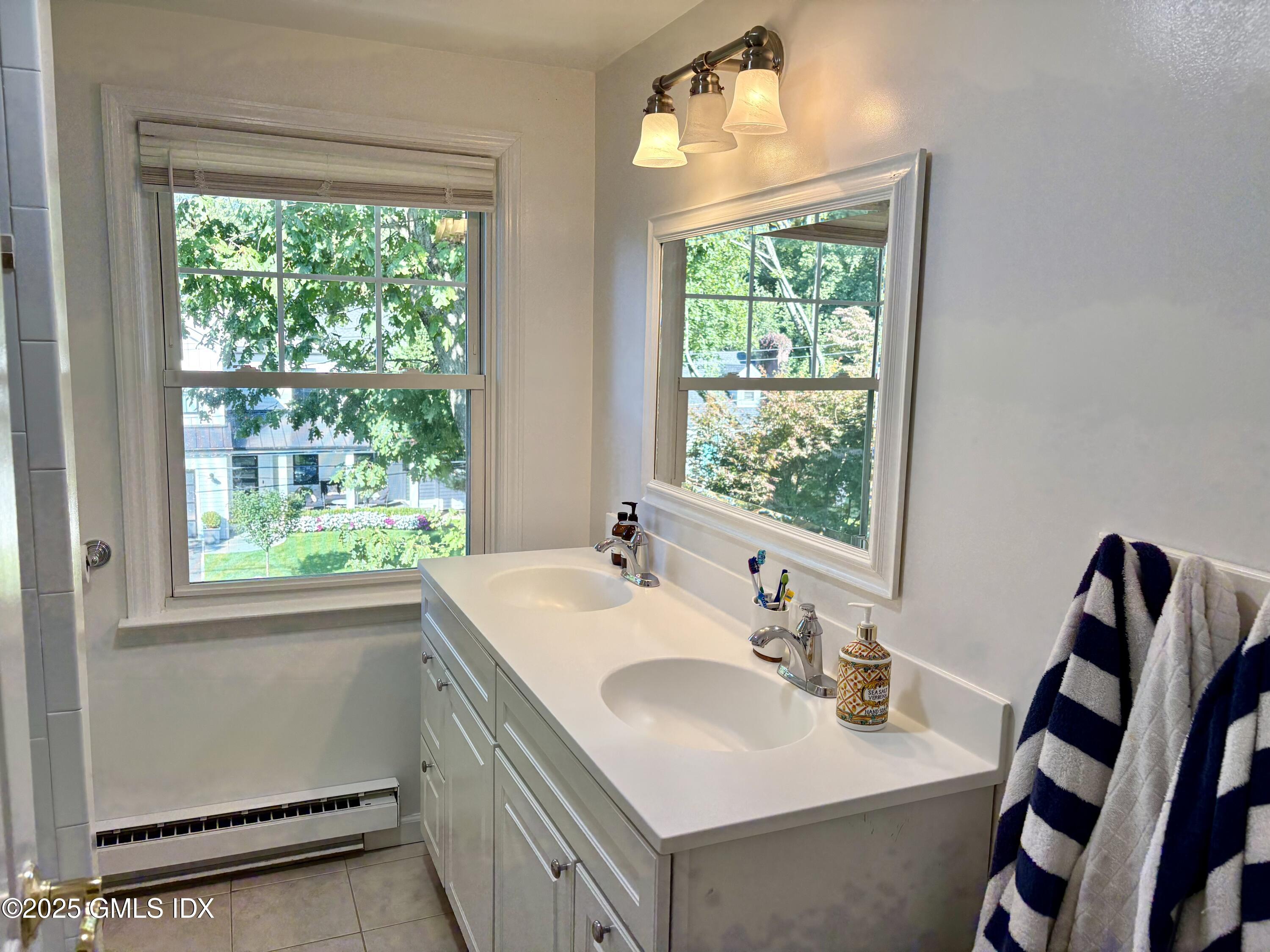 19 Wescott Street Riverside, CT 06878 - Photo 15 of 21 a bathroom with a sink vanity and a mirror