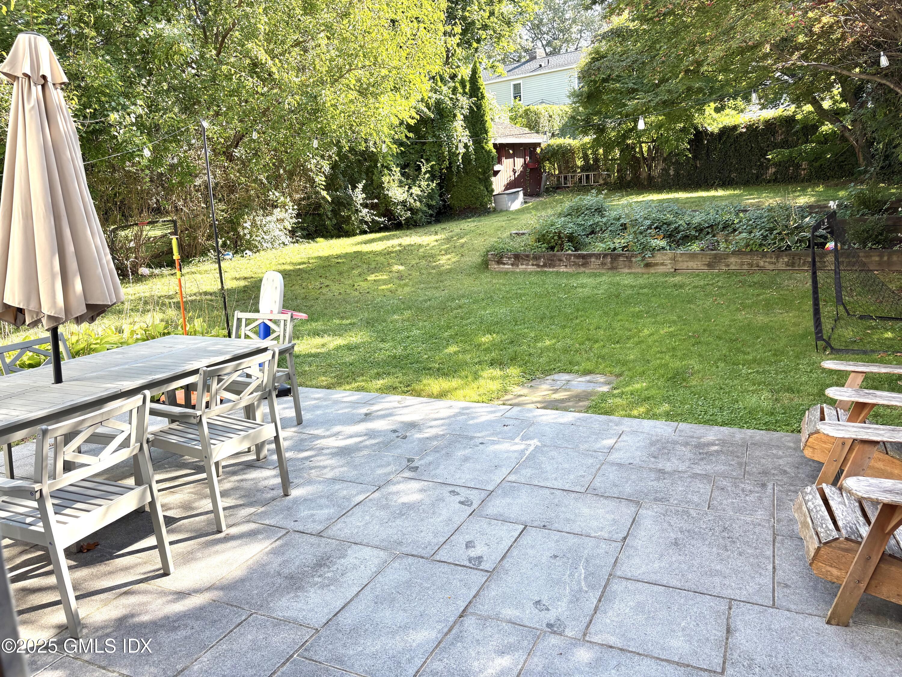 19 Wescott Street Riverside, CT 06878 - Photo 19 of 21 a view of backyard with swimming pool and green space