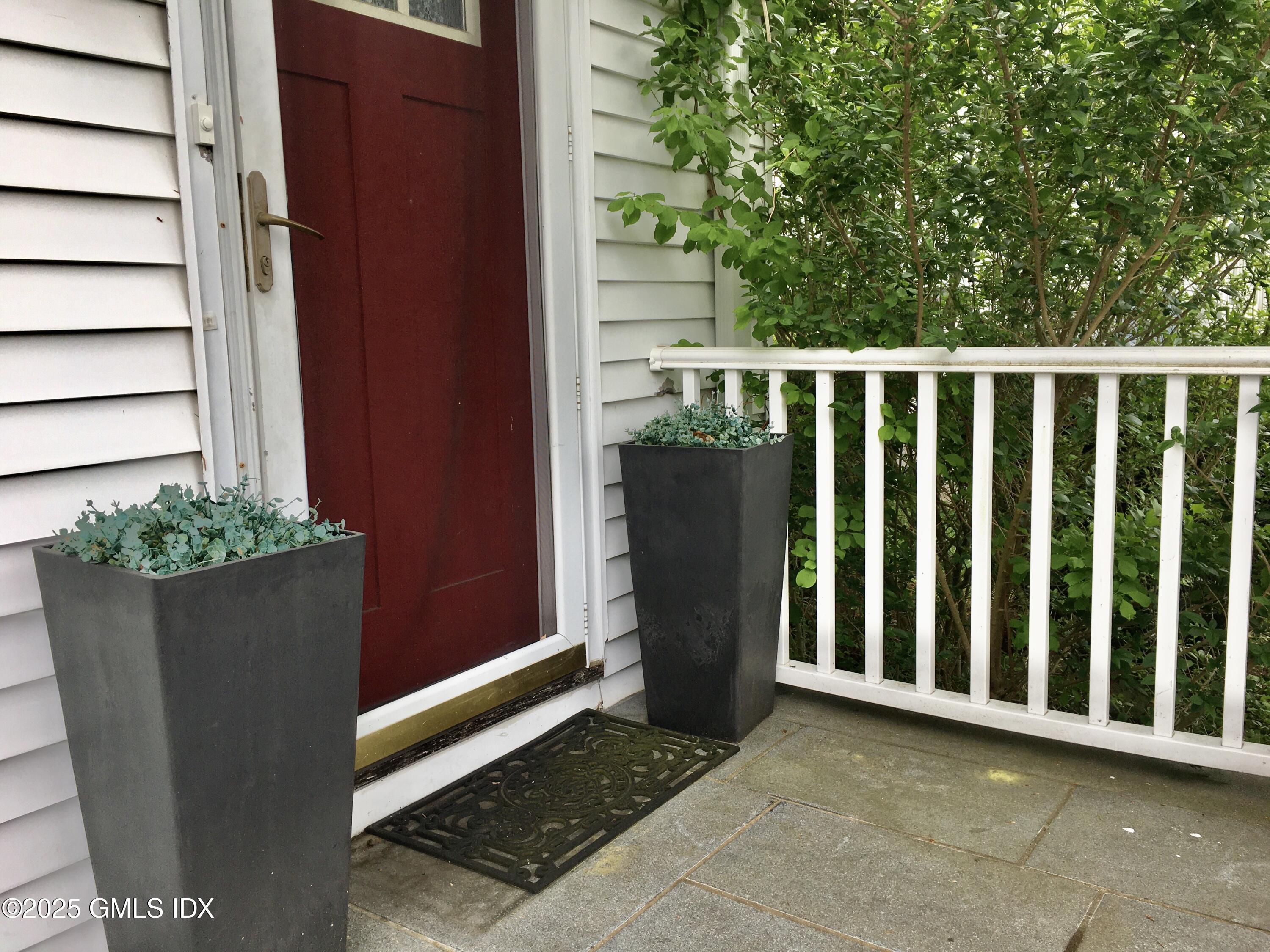 19 Wescott Street Riverside, CT 06878 - Photo 2 of 21 a view of a small yard and wooden fence