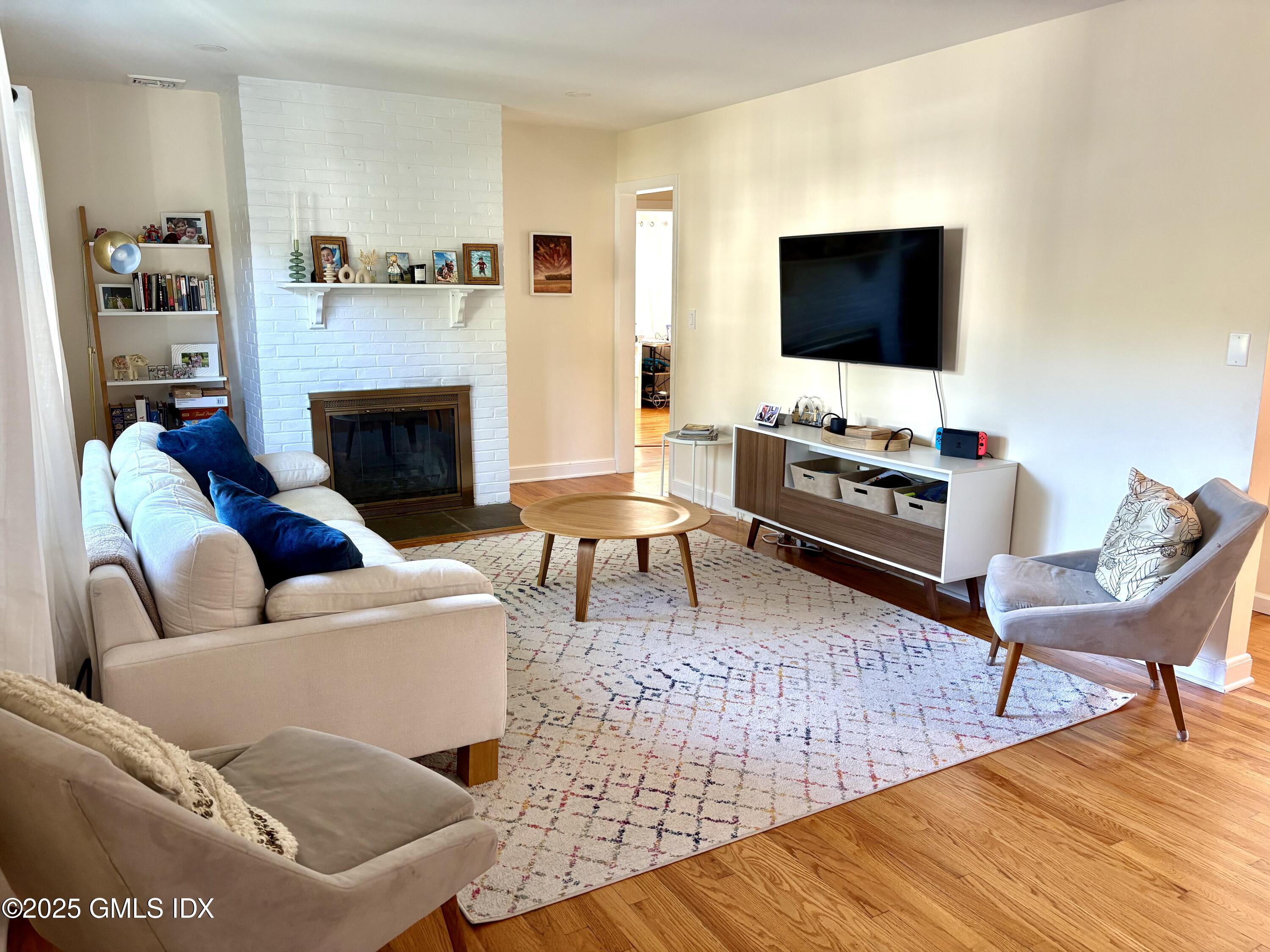 19 Wescott Street Riverside, CT 06878 - Photo 3 of 21 a living room with furniture and a flat screen tv