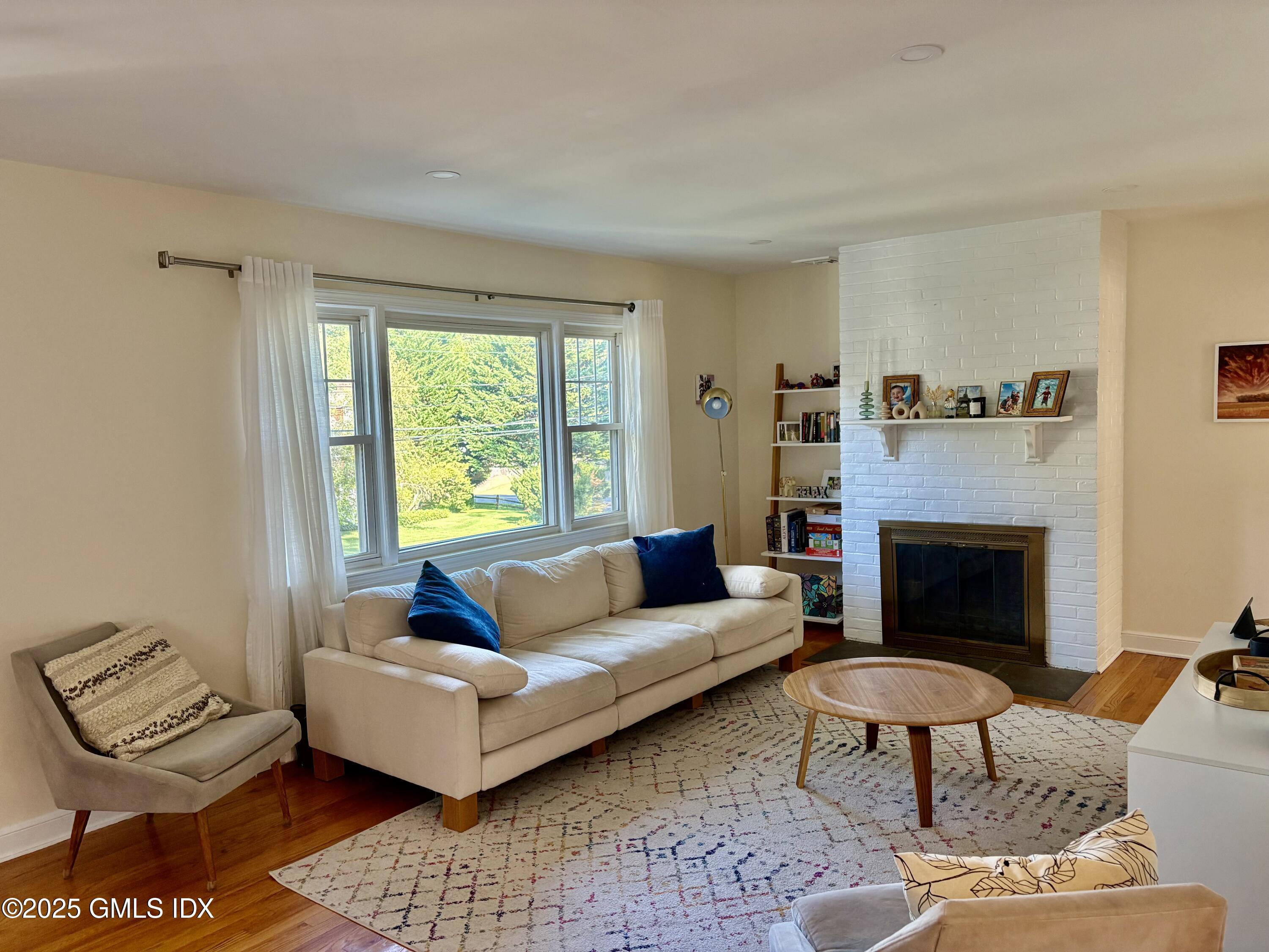 19 Wescott Street Riverside, CT 06878 - Photo 5 of 21 a living room with furniture and a fireplace