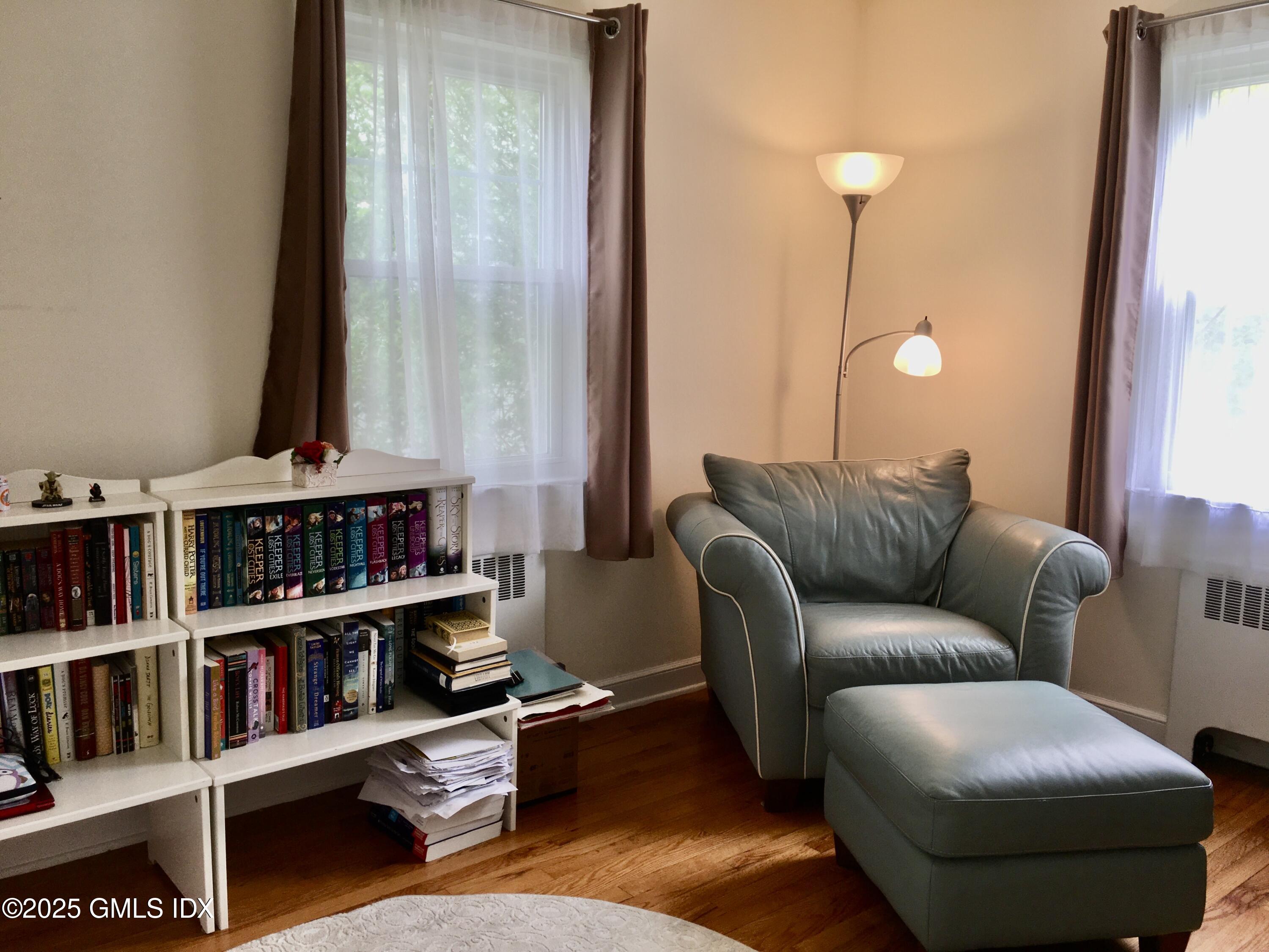 19 Wescott Street Riverside, CT 06878 - Photo 10 of 21 a living room with furniture and a book shelf