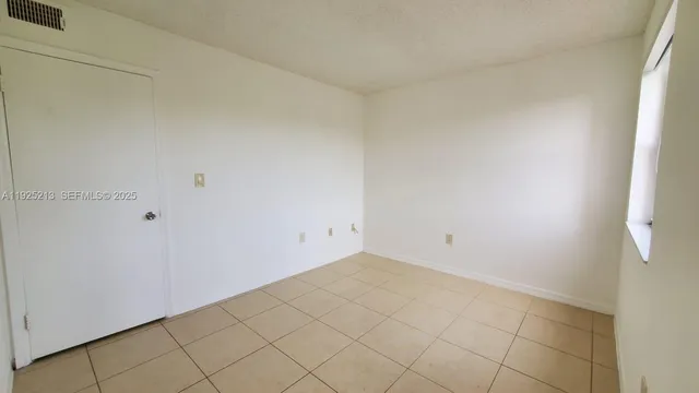 a white toilet sitting next to a bath tub