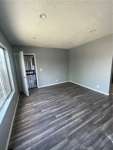 a kitchen with a sink a stove and cabinets