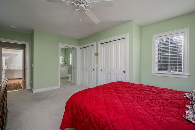 a bed room with a bed and a chandelier