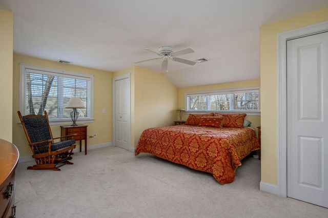 a bedroom with a bed and a desk