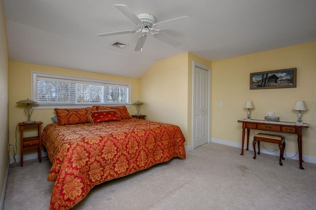 a bathroom with a toilet a sink and a mirror