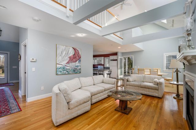 a living room with furniture or couch and a wooden floor