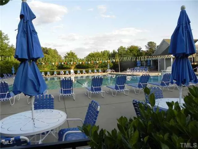a view of a patio with furniture and a potted plants