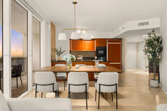 a view of a livingroom with furniture and a table