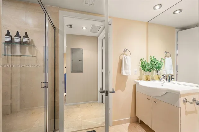 a bathroom with a sink vanity and a mirror