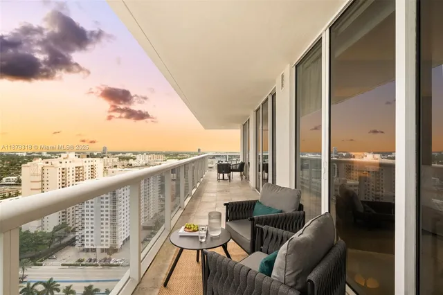 a view of a balcony with furniture