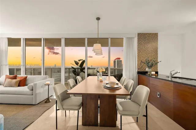 a dining room with furniture window and outside view