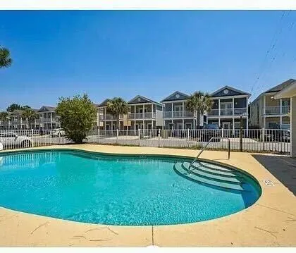 a view of a swimming pool with a patio