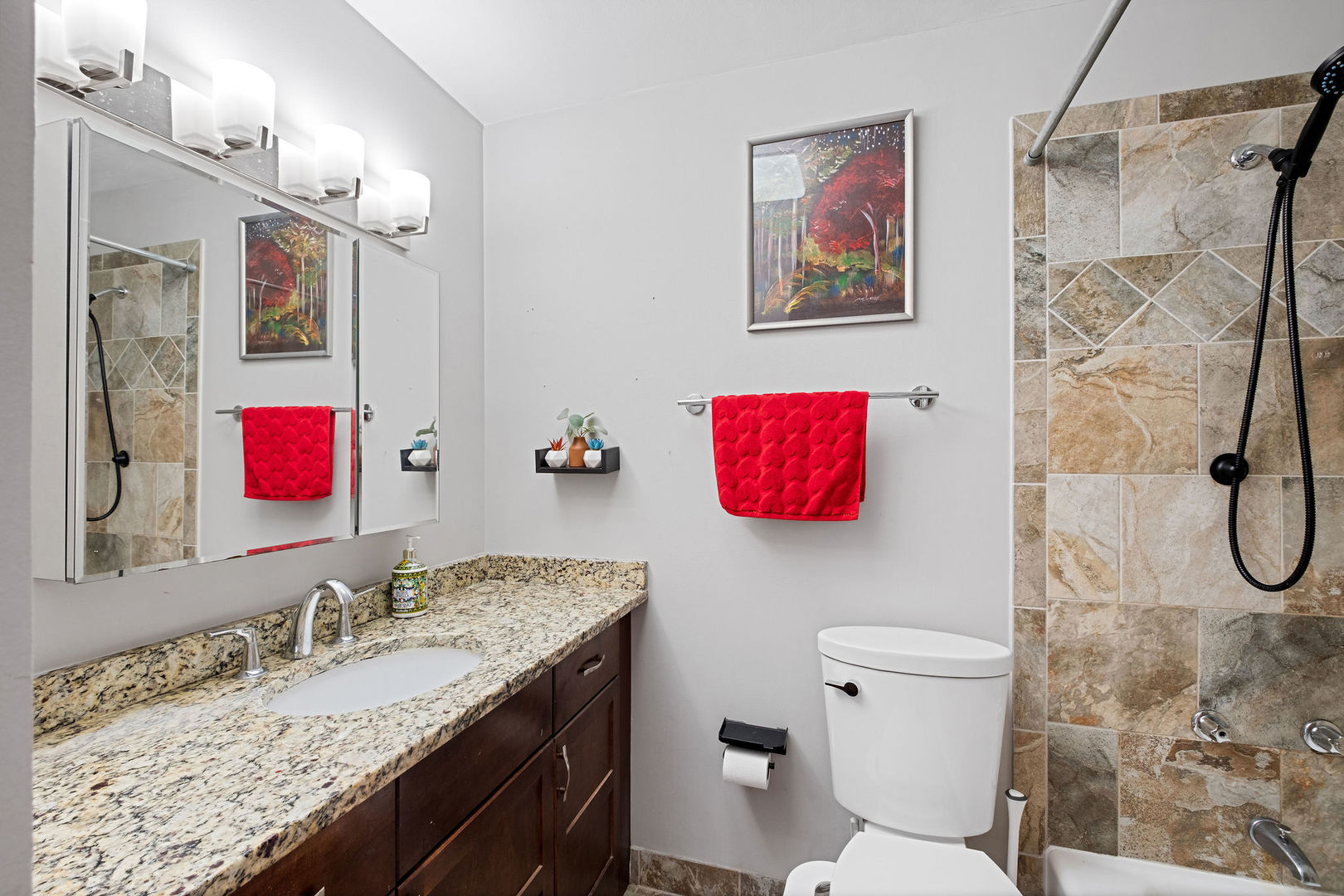 5445 North Sheridan Road, Unit 802 Chicago, IL 60640 - Photo 17 of 32 a bathroom with a granite countertop sink and a mirror