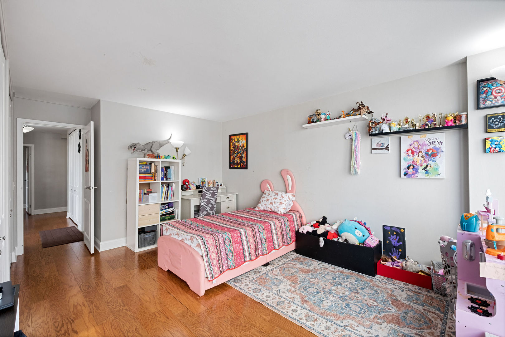 5445 North Sheridan Road, Unit 802 Chicago, IL 60640 - Photo 20 of 32 a bedroom with a bed and wooden floor