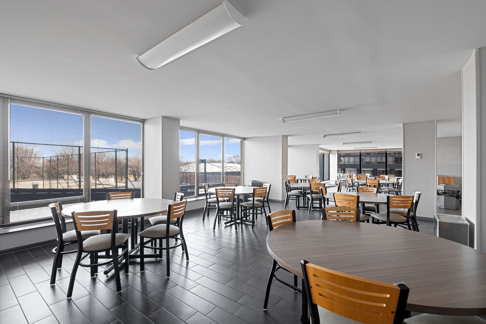 5445 North Sheridan Road, Unit 802 Chicago, IL 60640 - Photo 27 of 32 a view of a dining room with furniture window and outside view