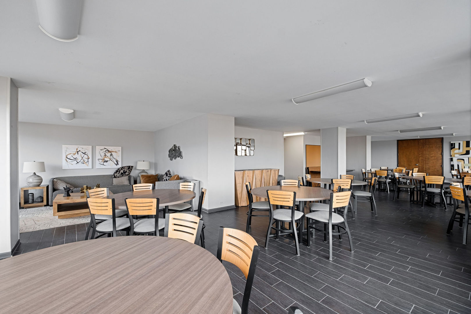 5445 North Sheridan Road, Unit 802 Chicago, IL 60640 - Photo 28 of 32 a dining room with lots of furniture and wooden floor