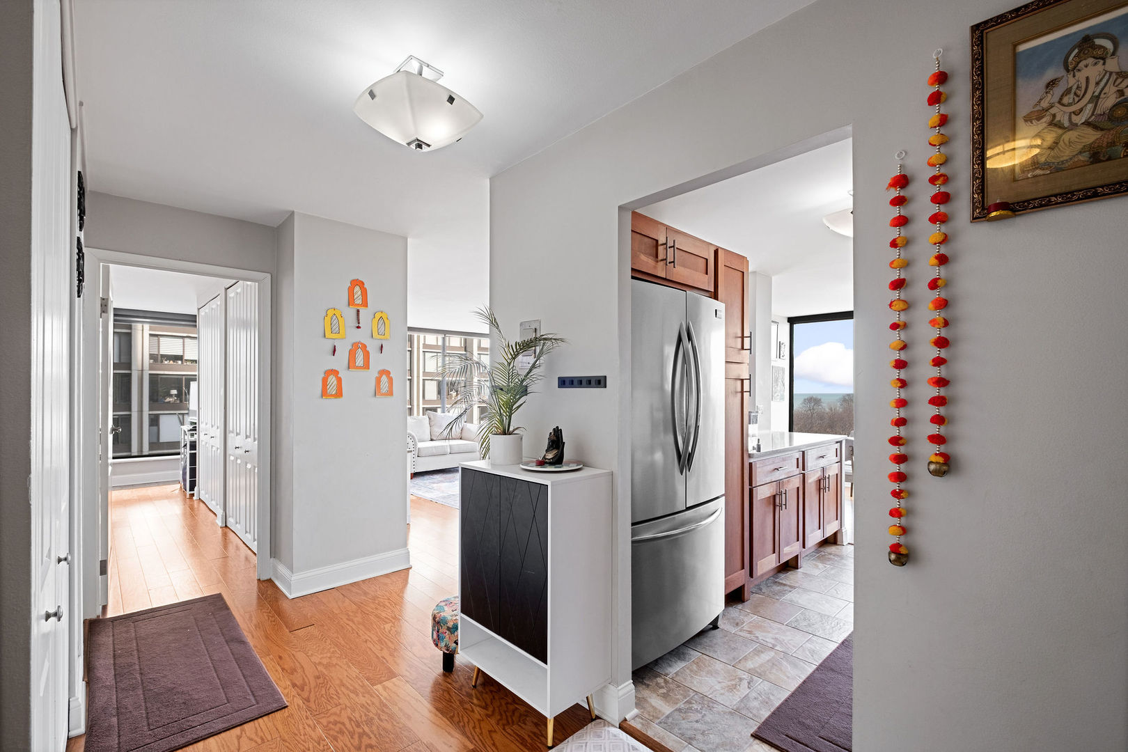 5445 North Sheridan Road, Unit 802 Chicago, IL 60640 - Photo 3 of 32 a view of a kitchen with fridge and workspace