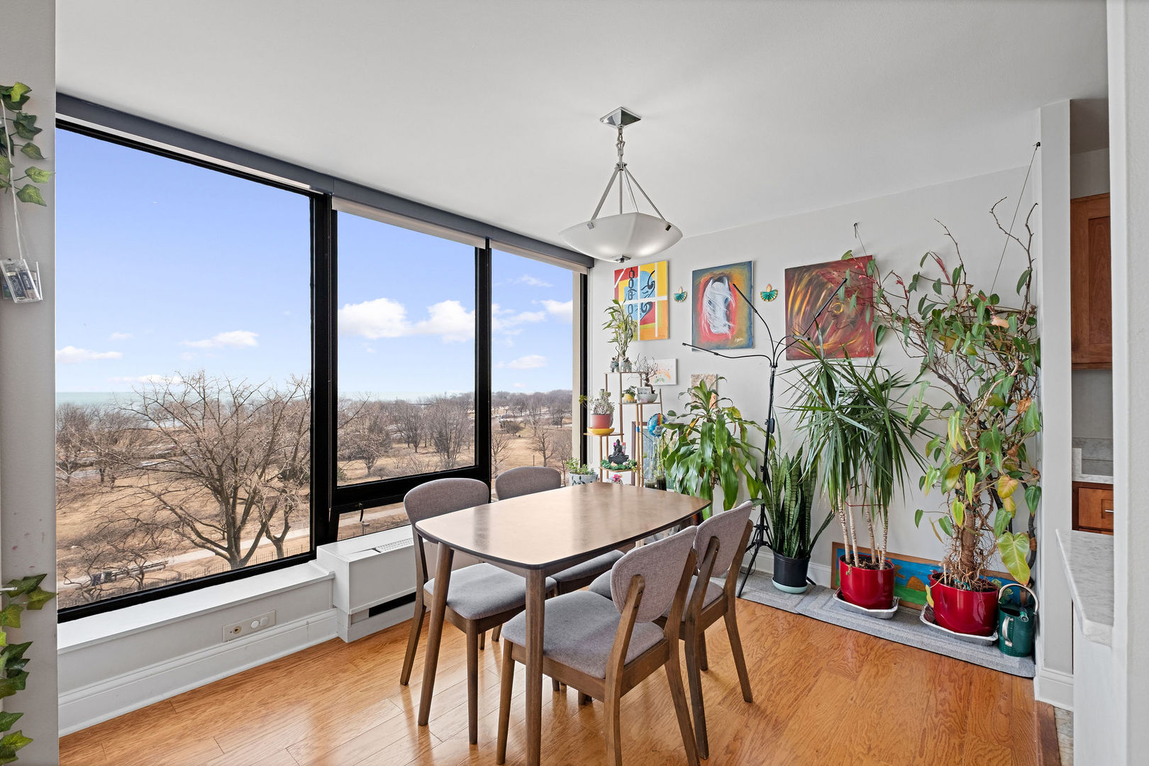 5445 North Sheridan Road, Unit 802 Chicago, IL 60640 - Photo 8 of 32 a view of a dining room with furniture window and outdoor view