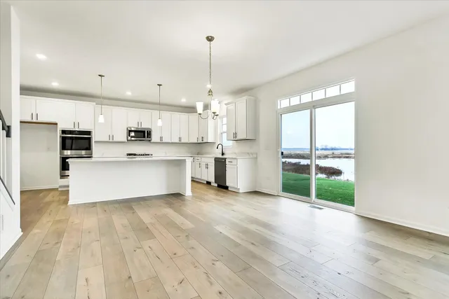 a view of kitchen with wooden floor and window