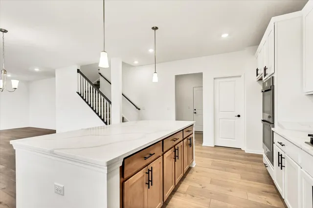 a hallway with a sink a washer and dryer