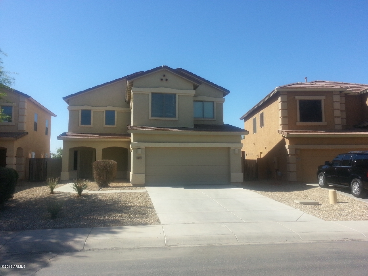 44395 Cypress Lane Maricopa, AZ 85138 - Photo 1 of 20 a front view of a house with a yard