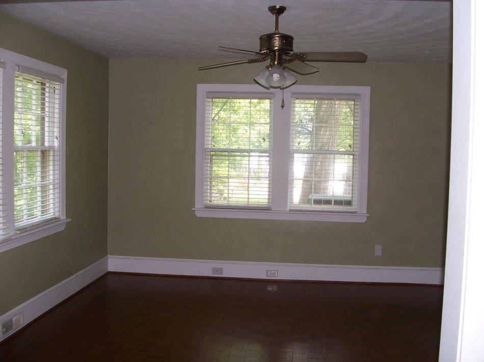 1065 Gross Hollow Road Blue Ridge, VA 24064 - Photo 3 of 8 a view of an empty room with wooden floor and a window