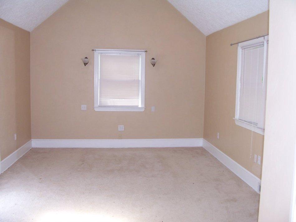 1065 Gross Hollow Road Blue Ridge, VA 24064 - Photo 5 of 8 an empty room with a window
