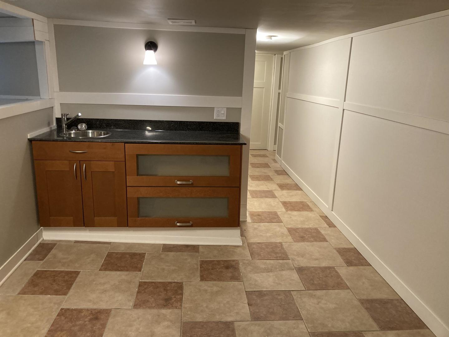 2863 West Belden Avenue, Unit 2 Chicago, IL 60647 - Photo 6 of 7 a stove top oven sitting inside of a kitchen