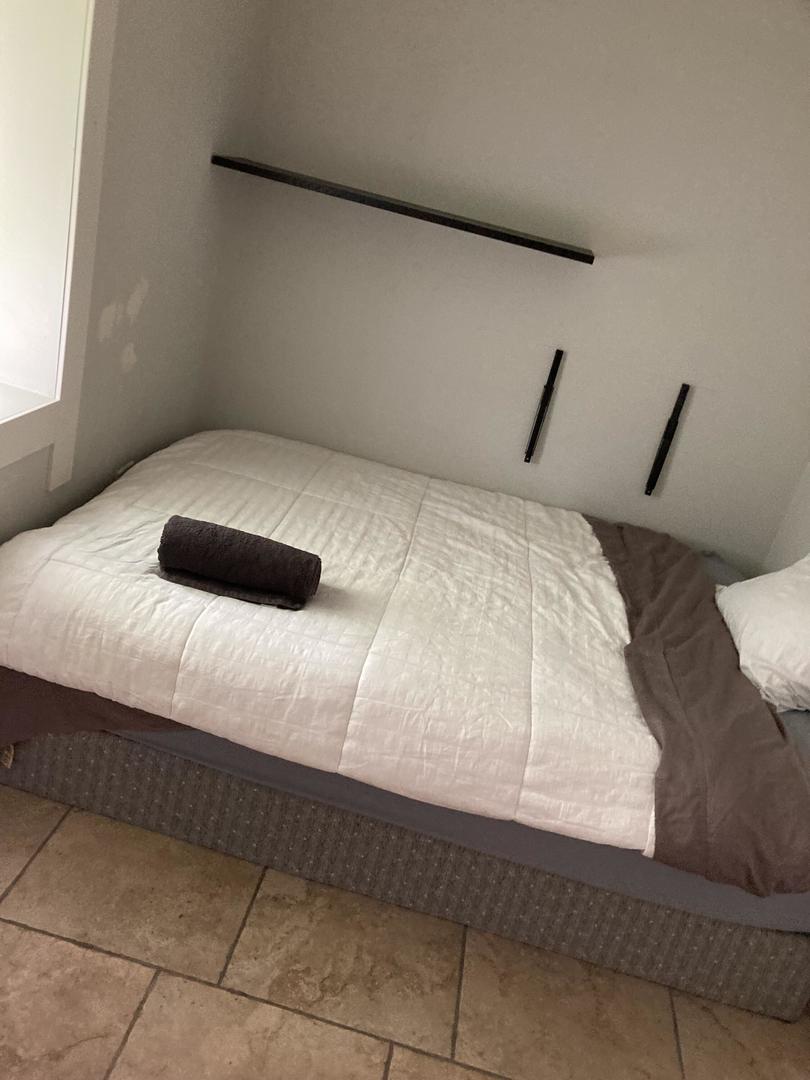 2863 West Belden Avenue, Unit 2 Chicago, IL 60647 - Photo 7 of 7 a bedroom with a bed and a window