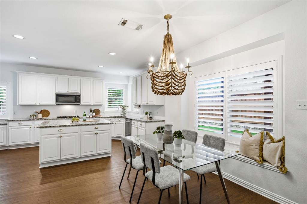 5201 Geode Lane McKinney, TX 75072 - Photo 13 of 37 Sunny kitchen nook with window seat and beautiful beaded chandelier.