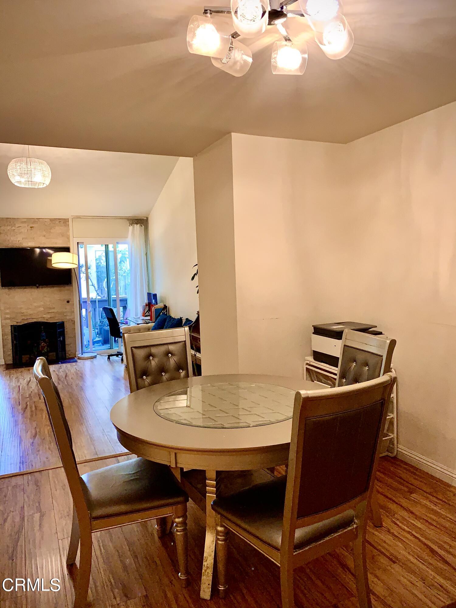 3232 La Vina Way Pasadena, CA 91107 - Photo 11 of 27 a view of a dining room with furniture and wooden floor
