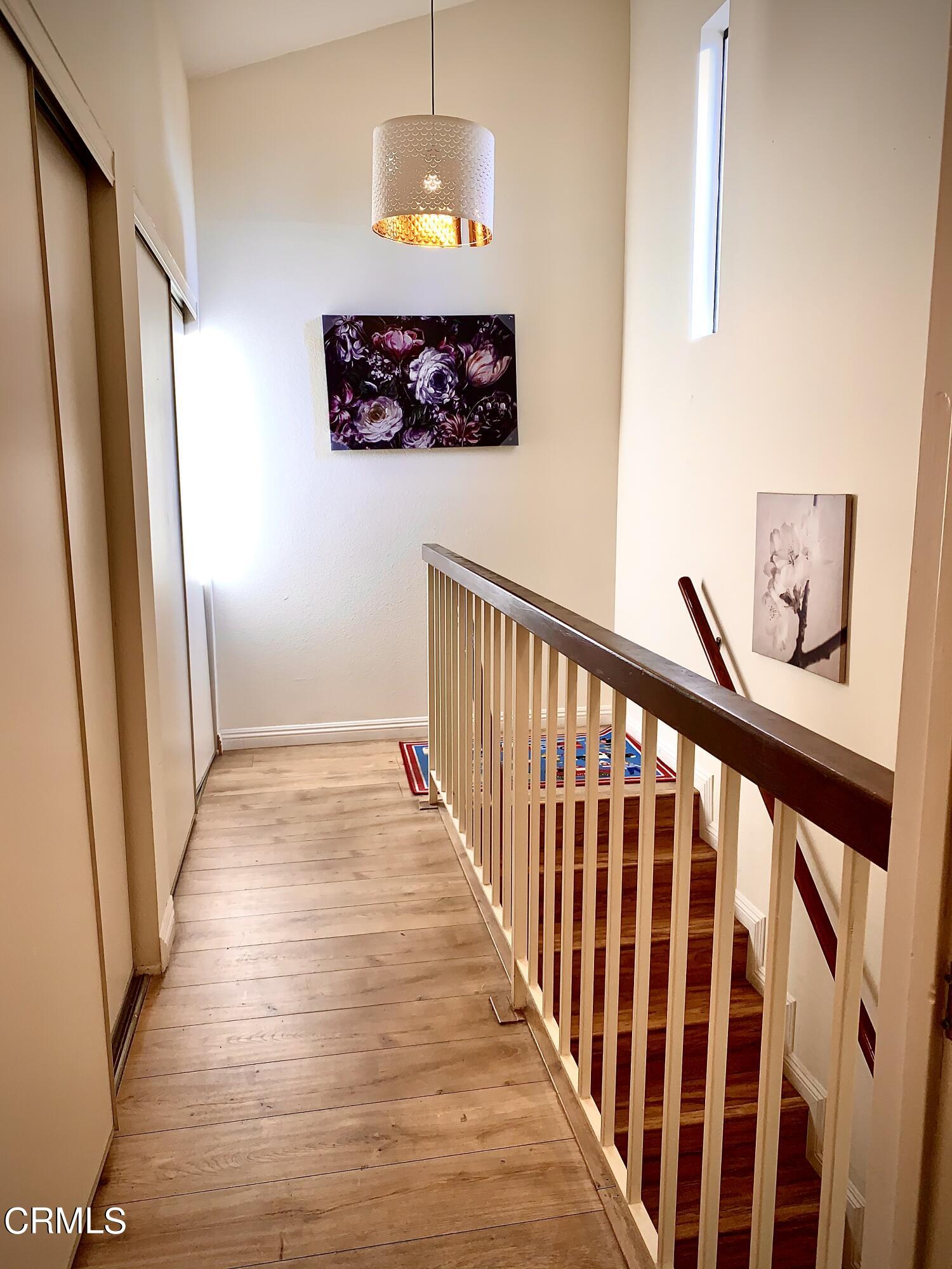 3232 La Vina Way Pasadena, CA 91107 - Photo 21 of 27 a view of a hallway with wooden floor and staircase