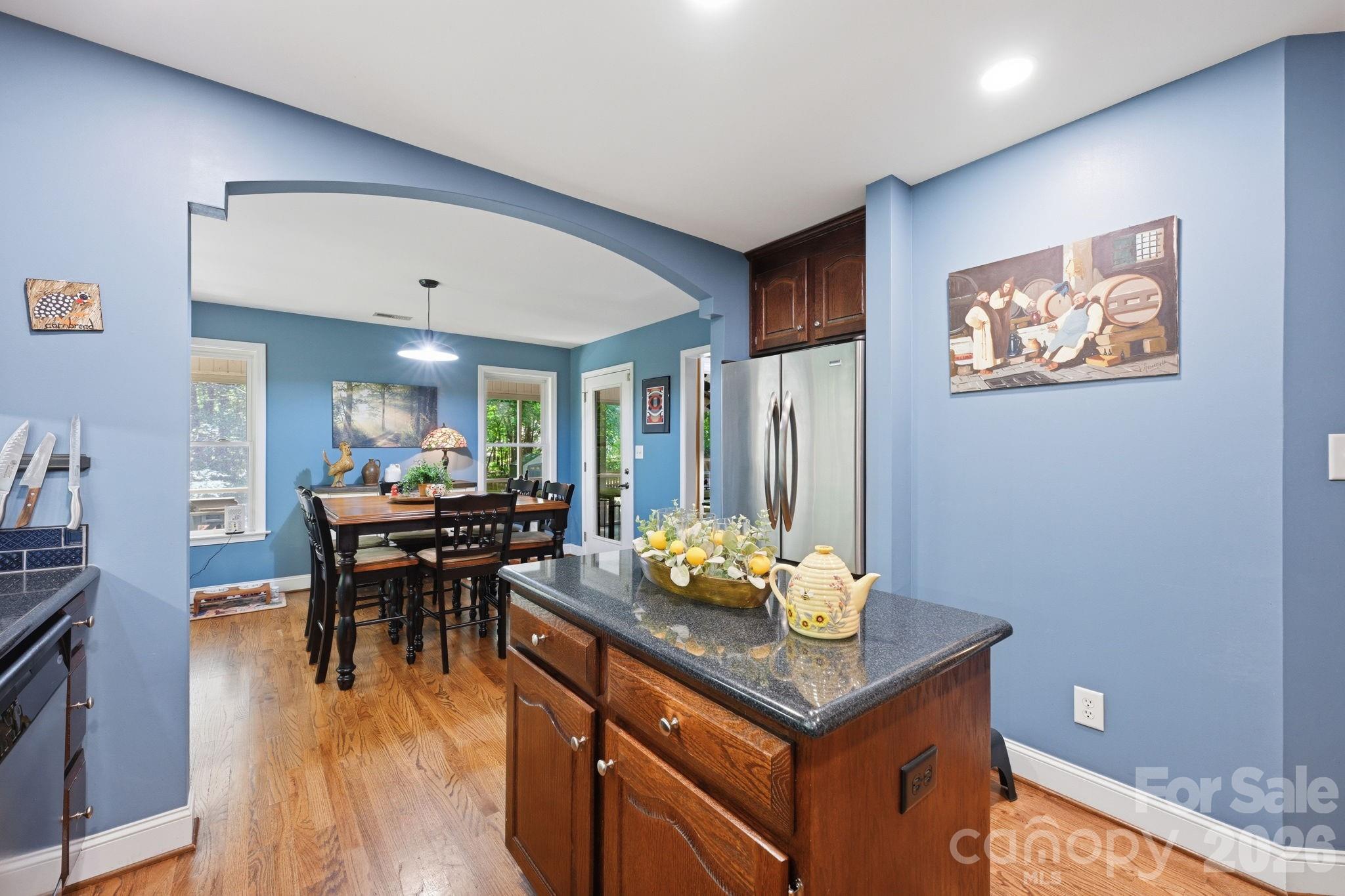145 Upper Spencer Mountain Road Stanley, NC 28164 - Photo 15 of 29 a view of a dining room with furniture and chandelier
