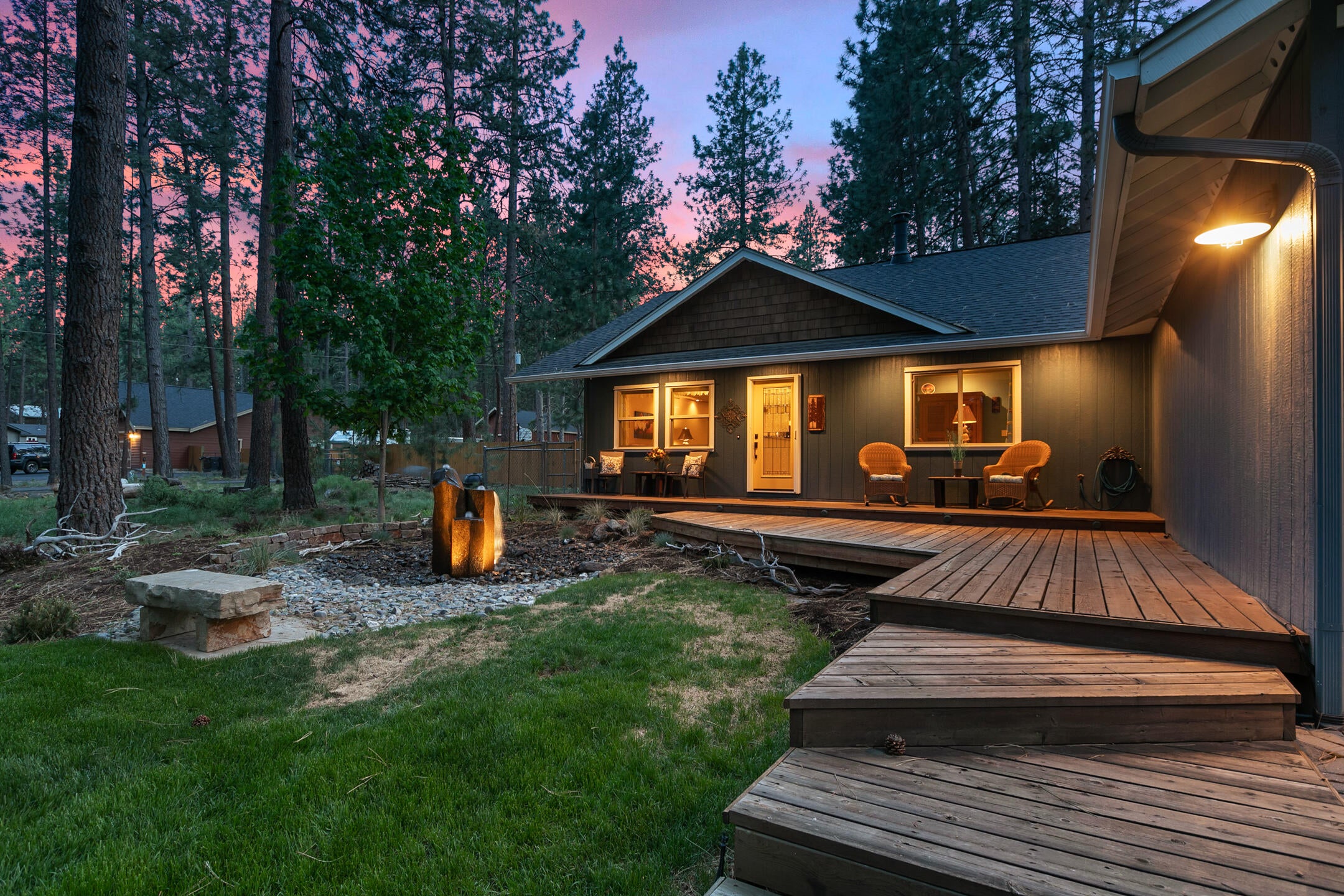 19175 Kiowa Road Bend, OR 97702 - Photo 36 of 44 Enjoy the lighting of the water feature and the front deck in the evening.