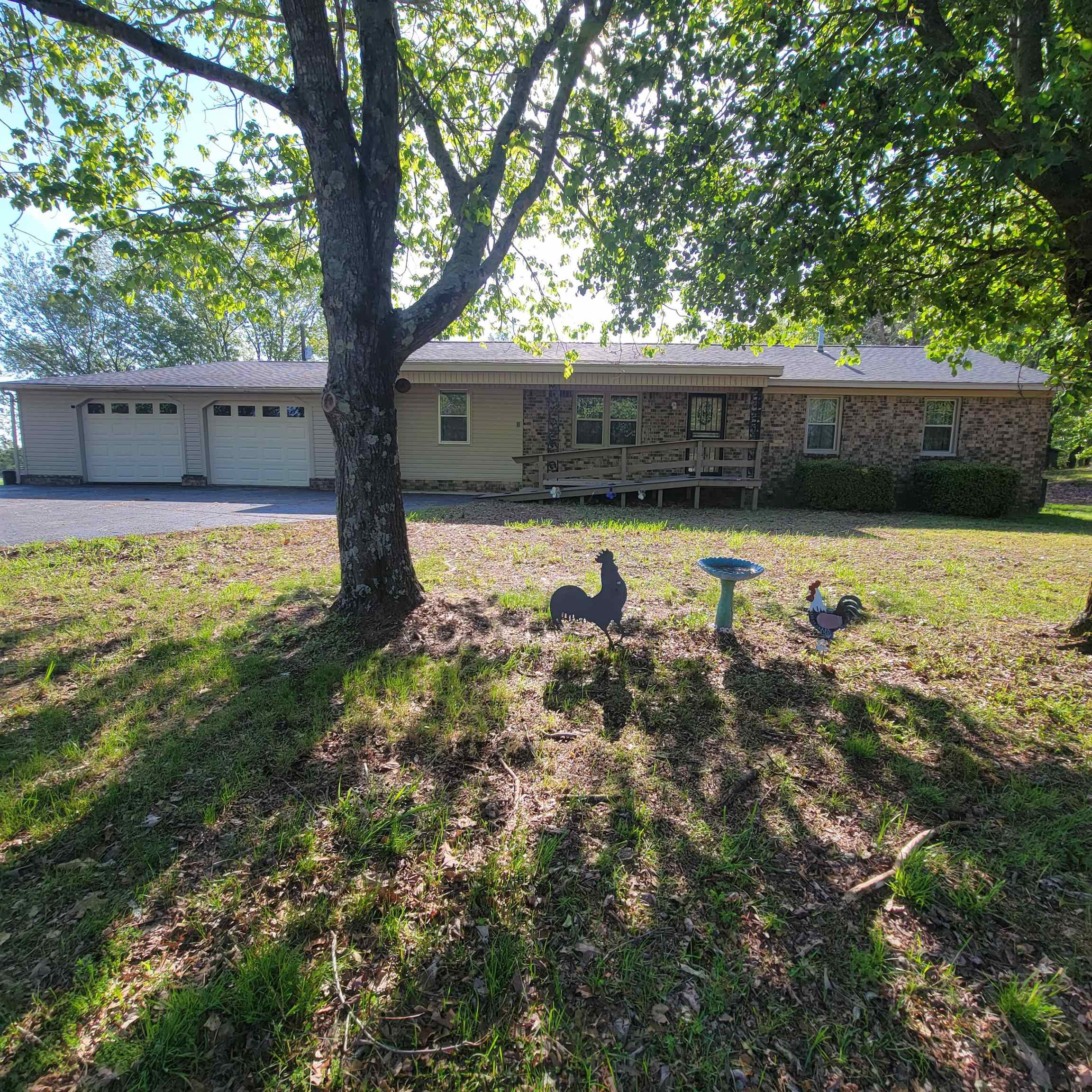 725 Diamond Grove Road Pinson, TN 38366 - Photo 1 of 10 a view of a yard with an tree