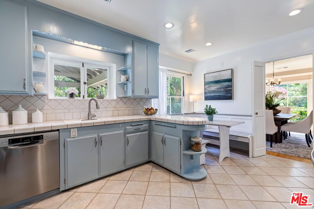 929 Mesa Verde Road Pasadena, CA 91105 - Photo 16 of 51 a kitchen with a sink and a stove top oven
